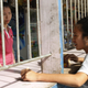 File photo from 2014 showing a customer buying groceries at a roadside store in Vaini, near Nuku’alofa, Tonga.